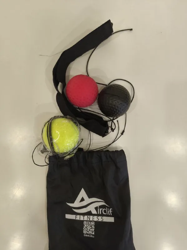 Boxing trainer with balls on elastic cords