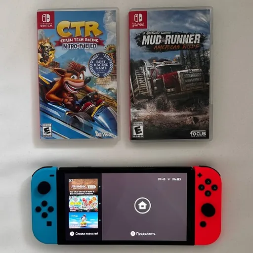 Nintendo Switch OLED, две игры