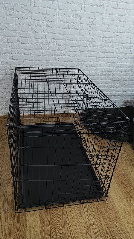 Металлическая клетка для собак