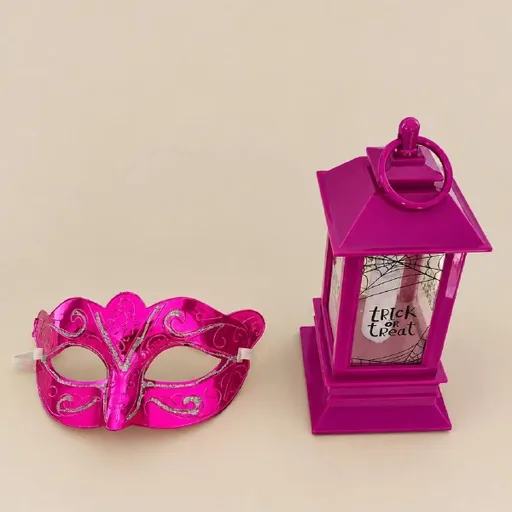 Battery-operated candle and Halloween mask