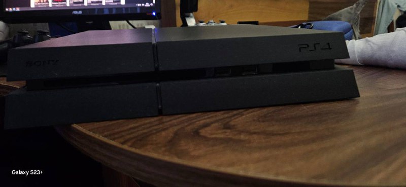 PS4 500GB with 2 controllers and games, PS3 250GB with games 2