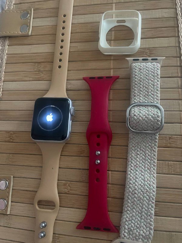Apple Watch series 3 with straps and charging cable