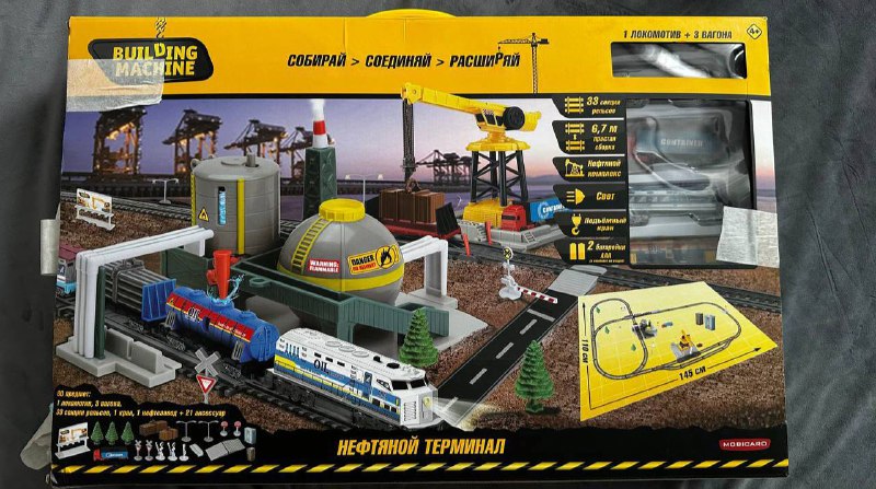 Building Machine Train Set with Tracks and Accessories