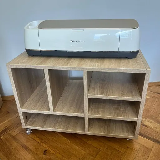Cricut Maker cutting plotter with materials and shelf