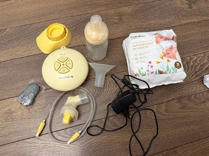 Молокоотсос Medela Swing, прокладки для груди