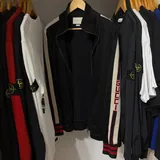 Gucci track jacket, Heron Preston hoodie, CP Company hoodie, Etudes T-shirt, Gucci sneakers, Adidas sneakers, Premiata sneakers 1