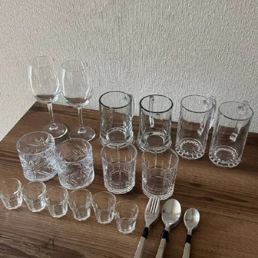 Glassware, utensils, lamps, projector, shelving unit, chair, sneakers, mousse