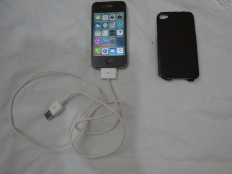 iPhone 4S, USB cable, and case