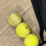 Polaroid camera, Panasonic camera, tanning foam, eyeliner, adapter, Minolta camera, headphones, tennis balls, women's bag 1