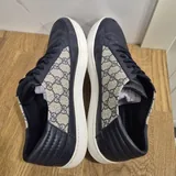 Жилет Versace, кеды Gucci, часы Diesel 6