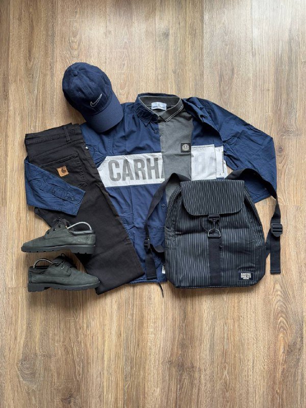 Рубашка Carhartt, Поло Stone Island, Джинсы Carhartt, Рюкзак Jean Paul Gaultier, Кепка Nike, Оксфорды Timberland