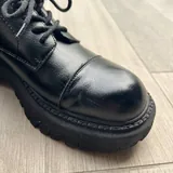 Black derby shoes with lug soles 4