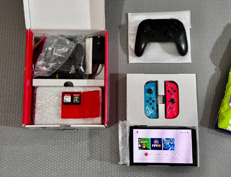 Nintendo Switch OLED, Pro Controller, картриджи 1