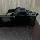 Nikon D5100 с объективом Nikon 55–300mm VR 4