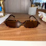 Очки Miu Miu, кошелек Lacoste, часы Donna Karan, Redmi 1