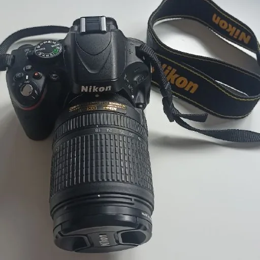 зеркальный фотоаппарат Nikon D5100 с объективом