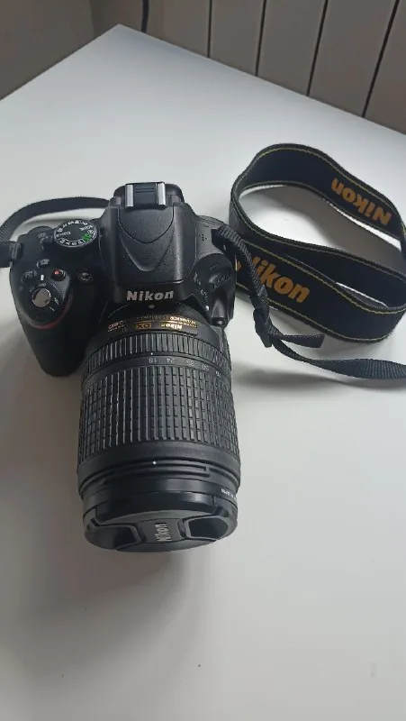 зеркальный фотоаппарат Nikon D5100 с объективом 1