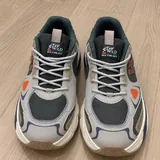 Stay Wild sneakers in the style of New Balance 9060 1