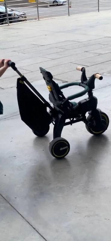 Doona Liki Trike, дождевик, сумка 1