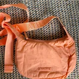 Jacket with fur collar, pink sweatshirt, tanning spray, sports bags, hair ties 4