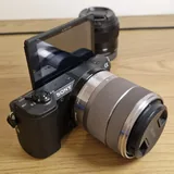 Sony a5100 camera, Sony 18–55 mm and 35 mm lenses, charger 5