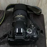 Nikon D5100 с объективом Nikon 55–300mm VR 5