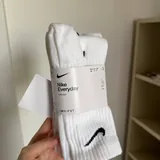 Носки Nike, фигурка Miniso, книга Fifty Shades of Grey 1