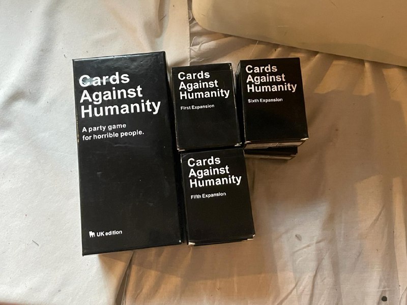 Cards Against Humanity, Catan, Azul, Root, UNO, пазлы, Dungeon Mayhem