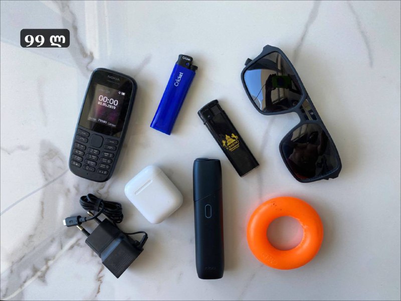 Nokia flashlight, Porsche Design glasses, AirPods, expander, IQOS, Cricket
