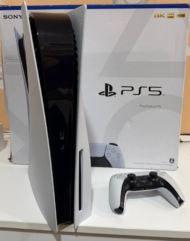 PlayStation 5 with disc drive and games 1