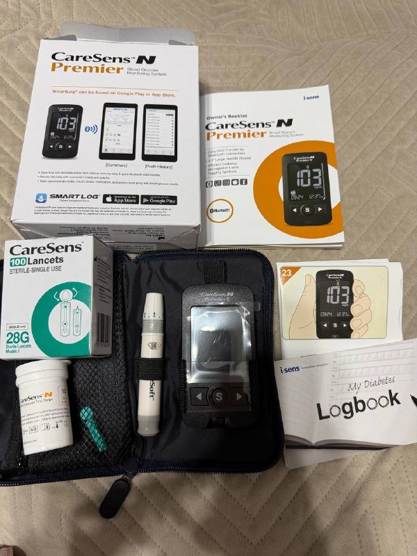 Глюкометр и новая пачка иголок CareSens Premier