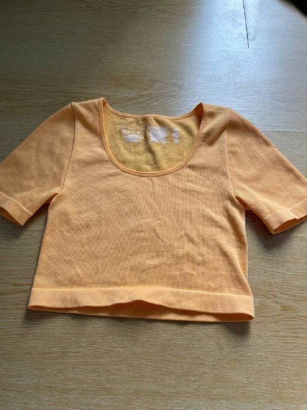 Оранжевый топик, юбка в клетку, лосины со звёздами для девочки