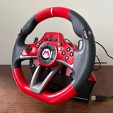 Роликовые коньки Rollerblade, игровой руль Mario Kart, шлем Atomic 1