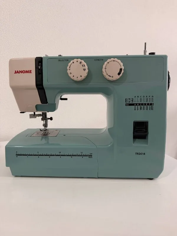 iPhone 15 Pro Max 256 GB, Janome TR2018 sewing machine 1