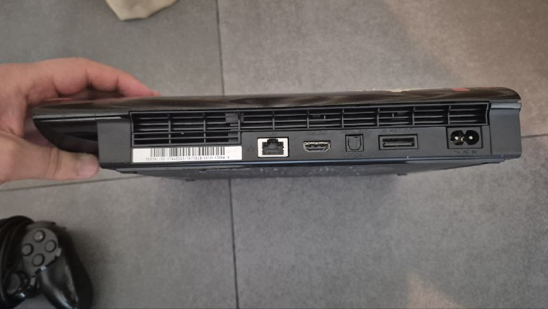 PlayStation 3 Super Slim with games and controllers 3