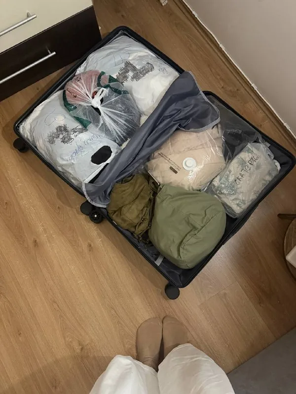 Suitcase of unworn women's clothing and shoes 1