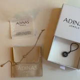 Браслет Swarovski, браслет Adinas, сережки TOUS, подвеска MOVA 5