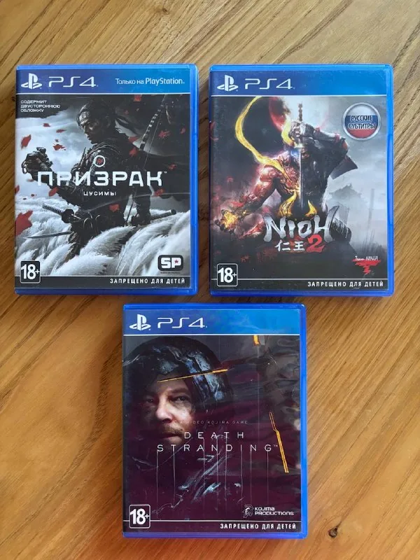 Диски Ghost of Tsushima, Death Stranding, Nioh 2, картридж Super Smash Bros Ultimate 1