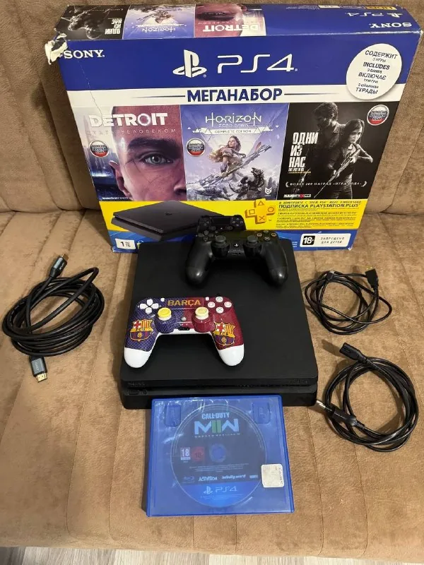 PlayStation 4 Slim 1TB with two controllers and a game