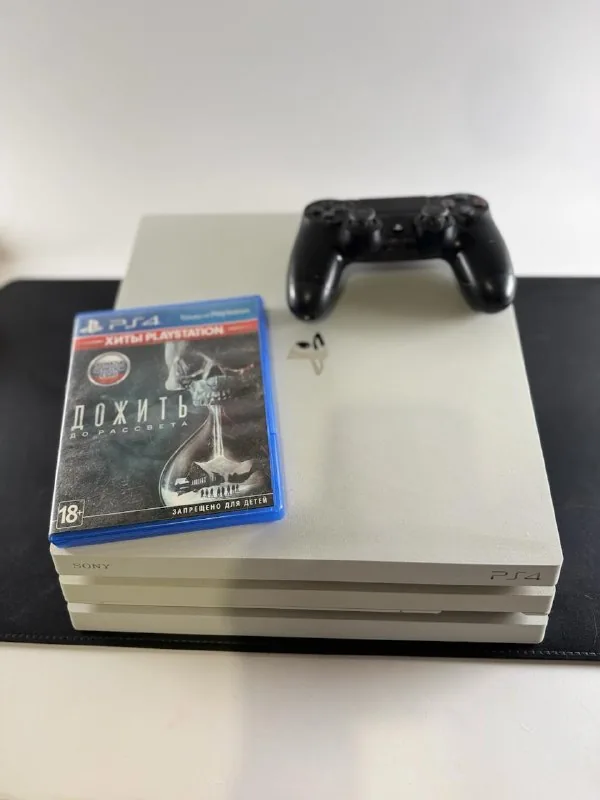 Sony PlayStation 4 Pro with controller and Until Dawn game