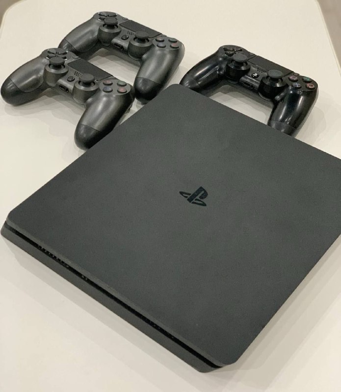 PlayStation 4 Slim 1TB with games and controllers
