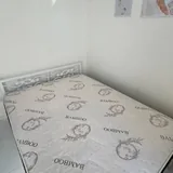 Bed with 150×200 mattress and wrought-iron headboard 2
