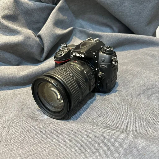 Фотоаппарат Nikon D7000 с объективом и зарядным устройством