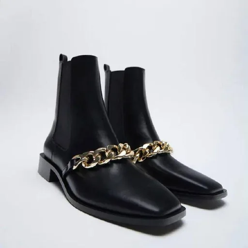 Black boots with a gold chain, size 38