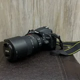Nikon D5100 с объективом Nikon 55–300mm VR 3