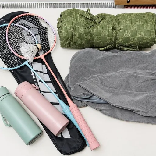 Picnic blanket, inflatable pillows, badminton, bottles