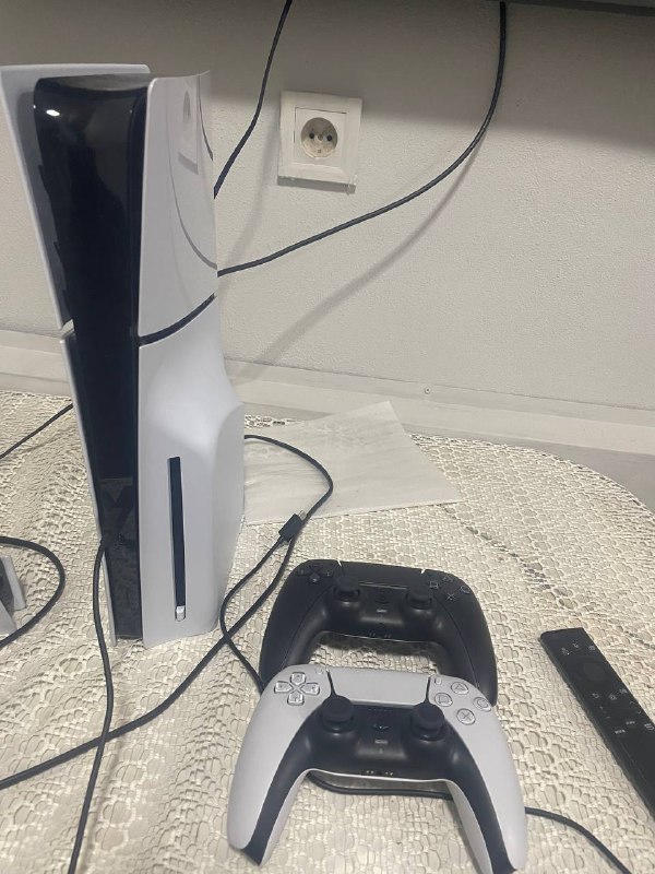 PlayStation 5 slim disc version with two controllers