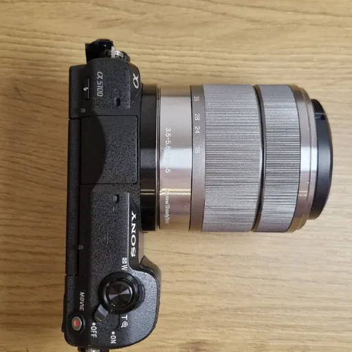 Sony a5100 camera, Sony 18–55 mm and 35 mm lenses, charger