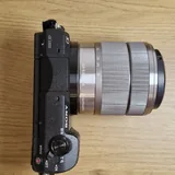 Sony a5100 camera, Sony 18–55 mm and 35 mm lenses, charger 1
