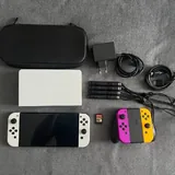 Nintendo Switch OLED с джойконами, чехлом, игрой 1